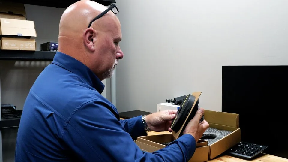 C2 technician working with network equipment